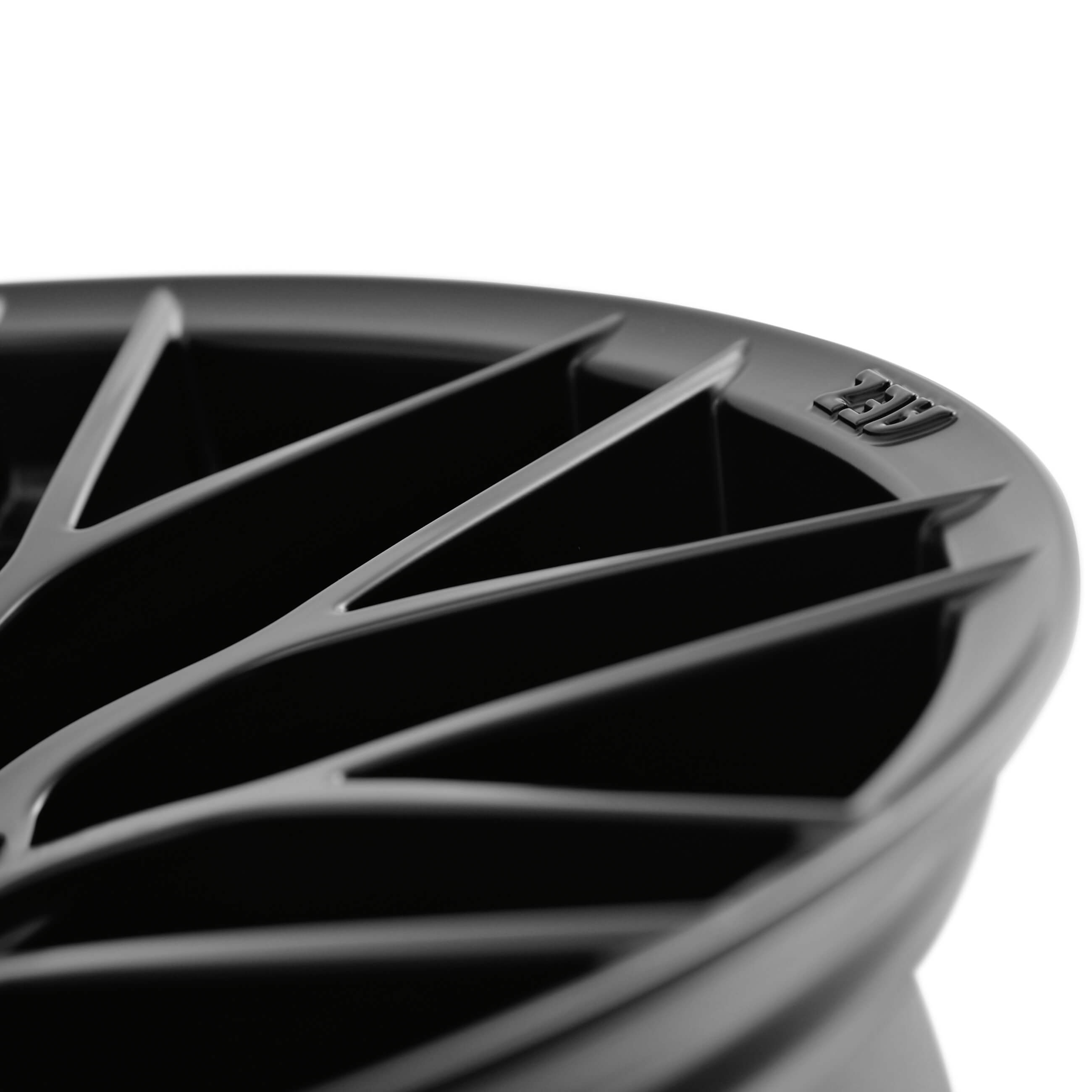 AEZ Antigua dark alloy rim cross-spoke-design detail above matt-black