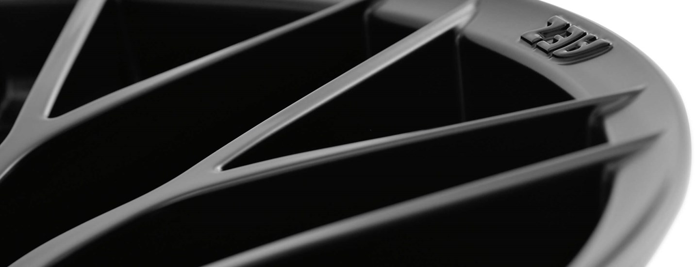 AEZ Antigua dark alloy rim cross-spoke-design detail above matt-black