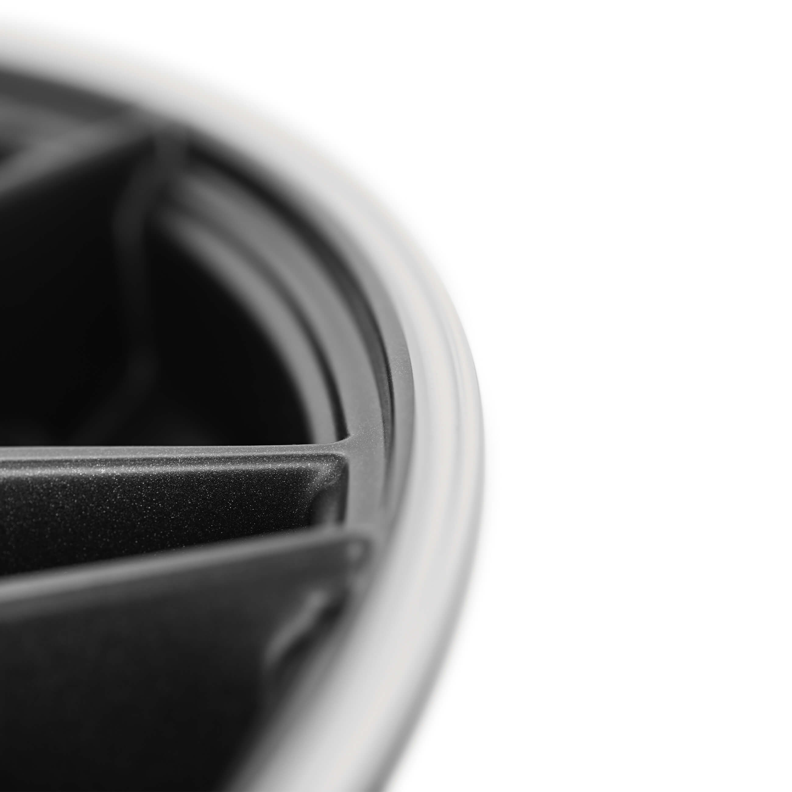 AEZ Crest dark alloy wheel detail above premium vehicles