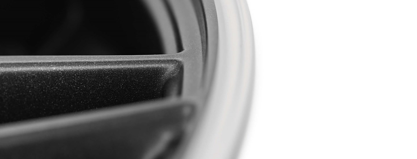 AEZ Crest dark alloy wheel detail above premium vehicles