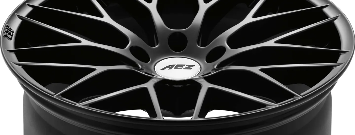 AEZ Antigua dark alloy rim cross-spoke-design detail above